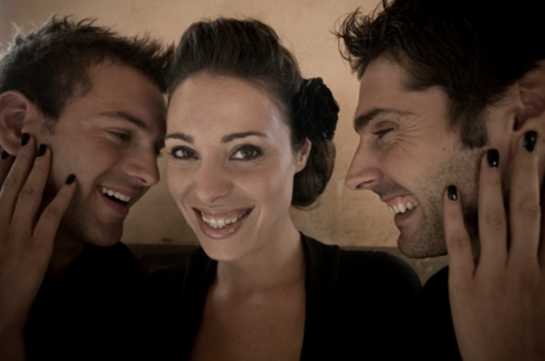 Two Men and a Woman Smiling