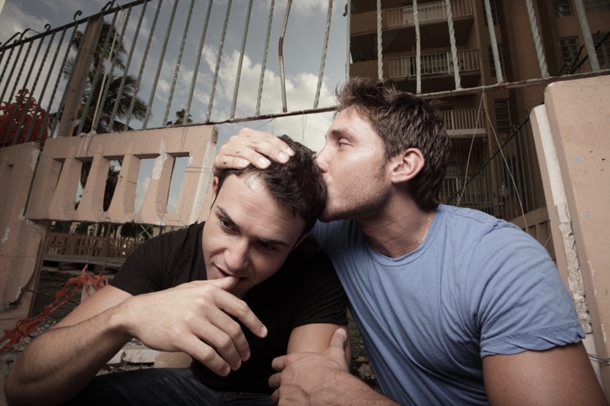 Man Kissing Other Man's Head