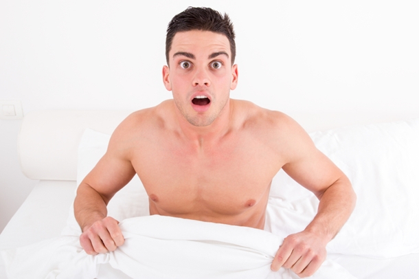 Shocked Naked Man Looking Under the Covers